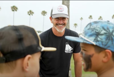 Mark Schulein Smiling in front of a tree